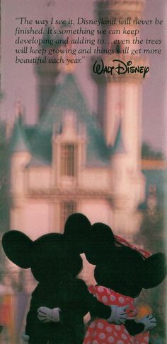 two mickey mouses kissing each other in front of a castle with the words walt written on it