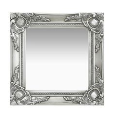 an ornate silver framed mirror on a white background