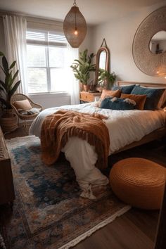 a bed room with a neatly made bed and lots of mirrors on the wall above it