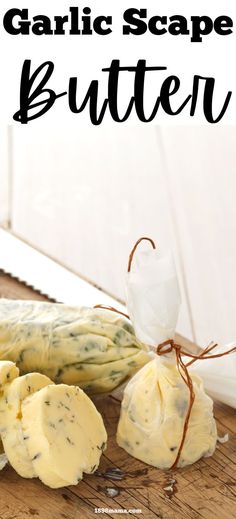 garlic scape butter on a cutting board next to an unwrapped bag