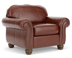 a brown leather chair with nail accents on the armrests and foot rests against a white background