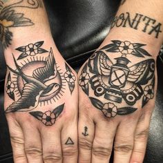 two hands with tattoos on them, one has a bird and the other has an eagle