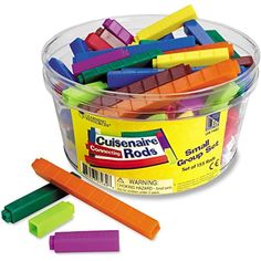 colorful crayons in a plastic container on a white background