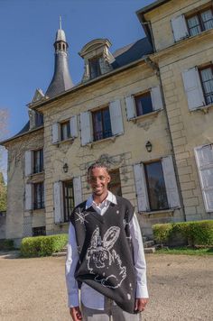 a man standing in front of an old building