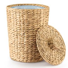 an empty wicker basket next to a candle holder on a white background with clippings