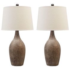 two brown and white ceramic lamps with shades on each lamp, one is turned off