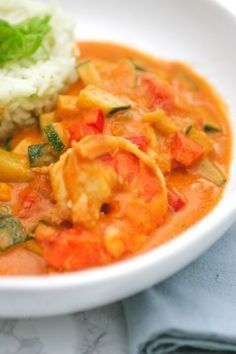 a white bowl filled with food and rice