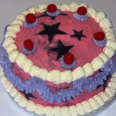 a red, white and blue cake sitting on top of a table