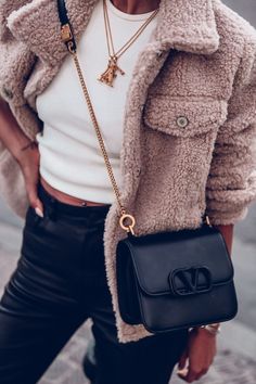 Love this black leather shoulder bag by Valentino - perfect for casual outfits - wearing a beige teddy jacket, white tank top, and black leather pants #handbag #shoulderbag #crossbodybag #teddyjacket #leatherpants #casualoutfit #outfit #casual #fashion First Sight Love, Viva Luxury, Teddy Bear Coat, Big Handbags, Bear Coat, Coat Trends, Sheepskin Jacket, Black Leather Shoulder Bag, Black Leather Pants