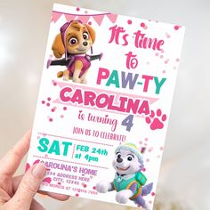 a person holding up a paw patrol birthday card