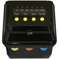 a black box with four different colored buttons on the front and side of it's lid