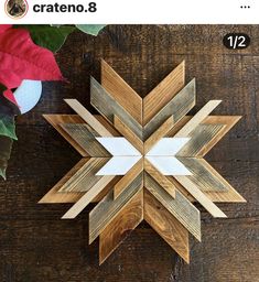 a wooden snowflake sitting on top of a table