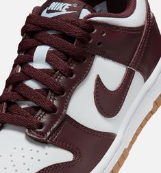 The Nike Dunk Low GS 'Burgundy Crush Gum' utilizes smooth leather on the upper, featuring a crisp white base with burgundy overlays and a color-matched Swoosh. Nike branding embellishes the woven tongue tag, sockliner, and back tab. Running Cap, Clog Boots, Nike Models, Adidas Spezial, Nike Brand, Air Jordan 3, Nike Acg, Nike Dunk Low, Air Max 1