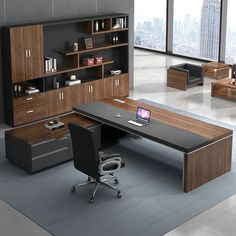 an office desk with a laptop on it