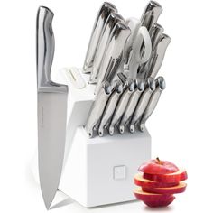 an apple and knife holder with many knives in it