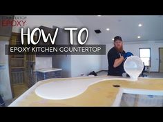 a man standing in front of a counter top with the words how to epoxy kitchen countertop