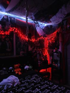 a bedroom decorated with halloween decorations and lights