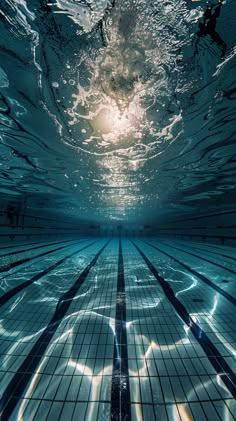 an underwater swimming pool with the sun shining down on it's floor and water surface