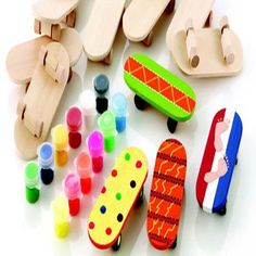 an assortment of wooden toys including skateboards and paint