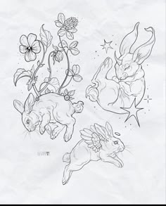 some drawings of rabbits and flowers on paper