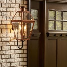 From the Charleston Copper and Brass Lantern Collection, the Rue De Royal outdoor lantern offers the historic look of gas lighting without the hassle of a propane feed. It is all electric and features a hand-riveted metal frame, combining the romantic charm of an antique lantern with the modern convenience of energy efficiency. The industrial bronze finish adds antique charm and depth, while the aged copper finish evokes a French countryside feel. Quoizel Rue de Royal 2-Light 22-in H Antique Cop Gas Lighting, Copper Wall Light, Antique Lanterns, Copper Lantern, Aged Copper, Gas Lights, Brass Lantern, Copper Wall, Outdoor Wall Lantern