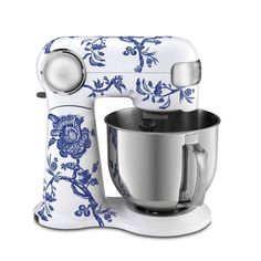 a blue and white kitchen mixer on a white background with an ornate design in the center