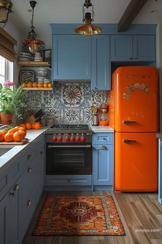 a kitchen with blue cabinets and orange appliances