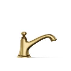 a gold faucet on a white background with no one in the room to see