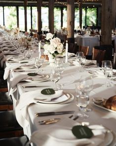 the table is set for an elegant dinner