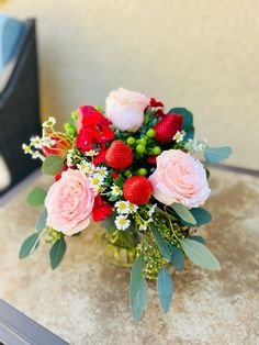 a vase filled with flowers on top of a table