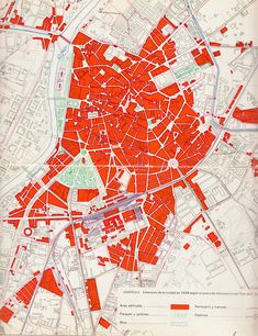 an old map with red lines on it and buildings in the middle, including streets