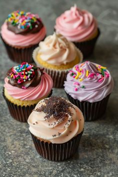 cupcakes with frosting and sprinkles on them