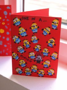 one in a minion birthday card on a window sill next to another greeting card