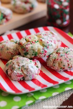 cookies with sprinkles on a red and white plate