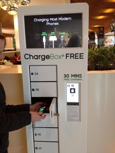 a woman is using the charge box free machine