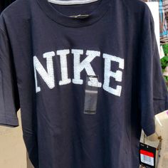 Nike Men's Large Black T Shirt Vintage Nike T Shirt, Nike Urban Tops With Letter Print, Nike Urban Cotton Tops, Nike Urban Short Sleeve Tops, Thrift Outfits, Nike Running Shirt, Tan T Shirt, Black And White Nikes, Street Fashion Men Streetwear