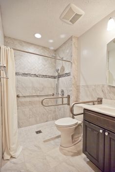 a bathroom with a shower, toilet and sink