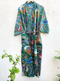 This Robe we makes from 100% Cotton printed fabric. The fabric print is Floral which is very popular in all over the world . We use pure cotton cambric fabric . This is free One size robe . There is both side pocket in robe. Length = 120 cms. ( 48 inches) Green Printed Sleepwear For Vacation, Green Summer Sleepwear For Home, Fitted Long Green Kimono, Green Printed Cotton Sleepwear, Green Long Sleeve Sleep Dress, Fitted Green Cotton Sleepwear, Fitted Green Kimono For Summer, Green Cotton Dress For Loungewear, Green Cotton Loungewear Dress