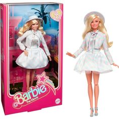 the barbie doll is wearing a white dress and hat