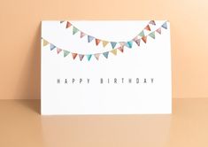 a birthday card with bunting flags on it