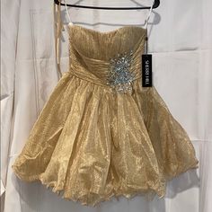 Absolutely Stunning Strapless Pleated Empire Waist Gold Sherri Hill Dress Size 8 Comes With Straps That Can Be Sewn On If Desired Gold A-line Evening Dress For Cocktail, Gold A-line Evening Dress For Cocktail Events, Gold A-line Cocktail Evening Dress, Strapless Champagne Dress For Party Season, Evening Mini Dress With Fitted Bodice In Gold, Gold Mini Dress With Fitted Bodice For Evening, Gold Strapless Dress With Fitted Bodice, Gold Strapless Dress For Formal Occasion, Elegant Gold Strapless Dress For Prom Season