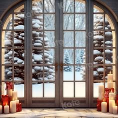 an open window with lit candles in front of it and snow covered trees outside the window