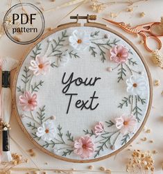 a cross stitch pattern with the words your text on it and some scissors next to it