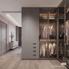 a walk in closet filled with lots of clothes and shoes on top of wooden floors