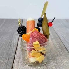 a glass bowl filled with fruit and vegetables