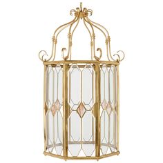 an antique brass hanging light fixture with glass panels