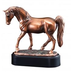 a bronze statue of a horse on a black base