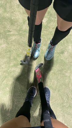 two people standing next to each other on a tennis court