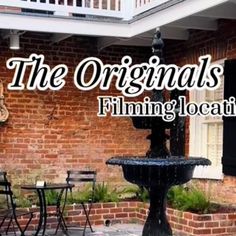 the originals film location is located in front of an old brick building with a fountain