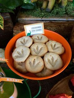 a bowl filled with cookies sitting on top of a table